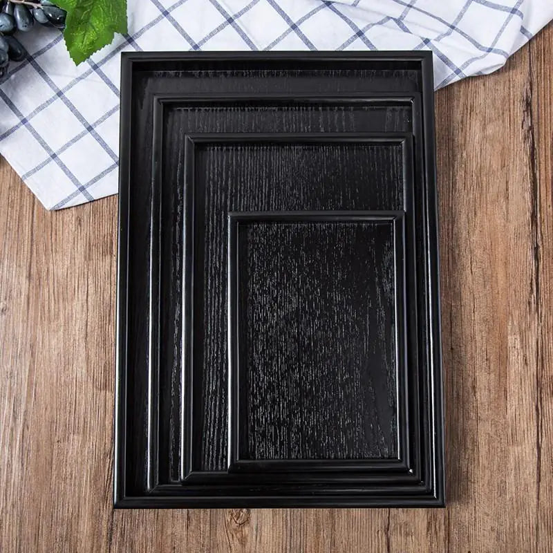 Bandejas de madera negra de estilo japonés.