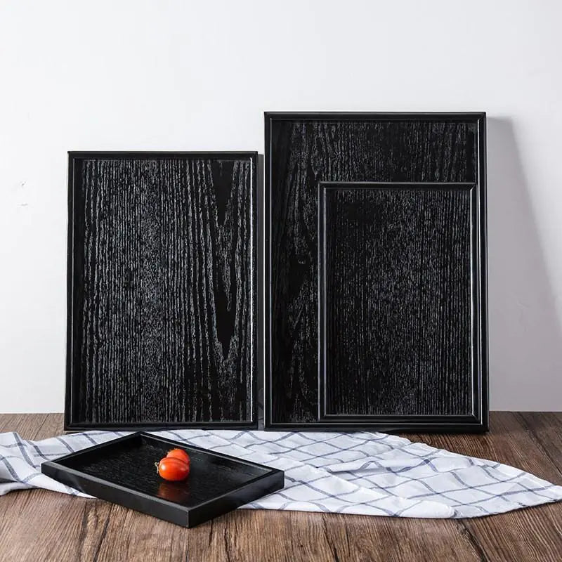 Bandejas de madera negra de estilo japonés.