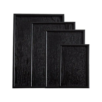 Bandejas de madera negra de estilo japonés.