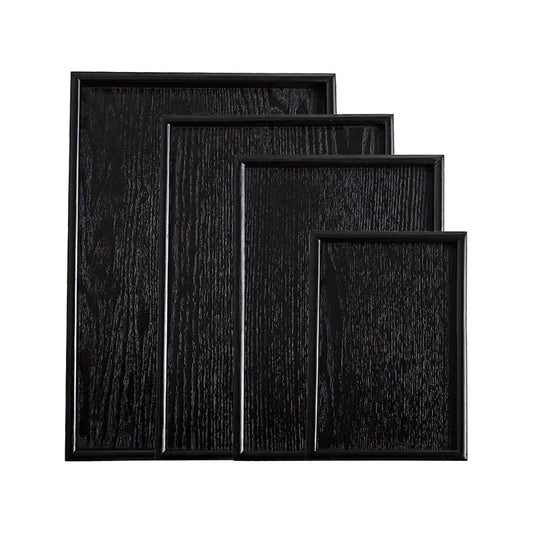 Bandejas de madera negra de estilo japonés.